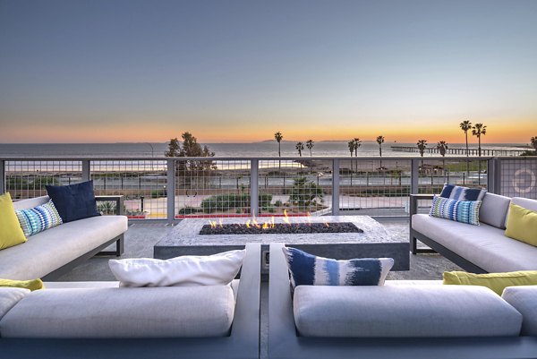 Cozy outdoor fire pit at Coastline Ventura Apartments with comfortable seating and ocean breeze