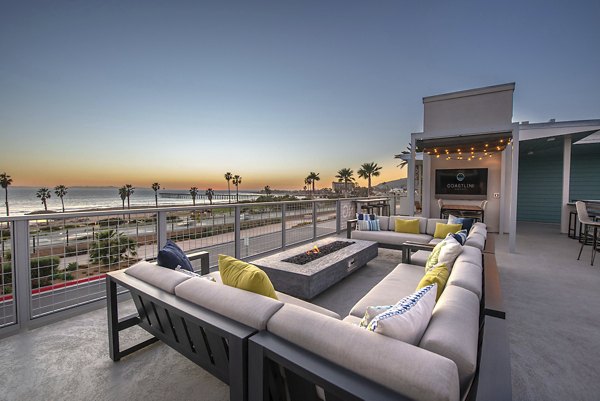 Leash-free dog park with agility equipment at Coastline Ventura Apartments