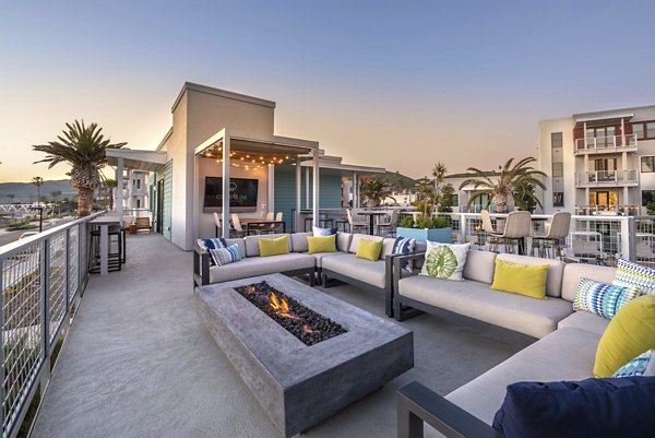 Coastline Ventura Apartments: Cozy outdoor fire pit area with seating for residents