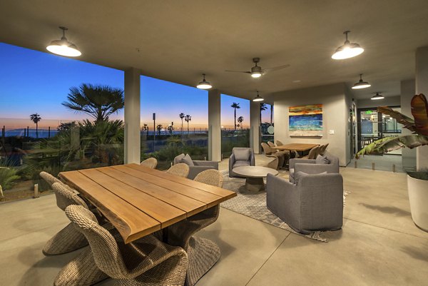 Cozy patio with modern furniture at Coastline Ventura Apartments, perfect for relaxation and outdoor gatherings in a luxury setting
