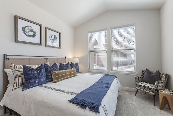 Elegant bedroom with modern decor at Overture Andalucia Apartments, a Greystar luxury property in Albuquerque, NM.