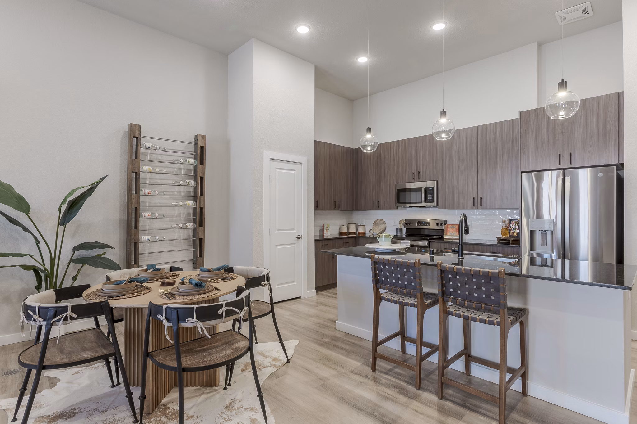 Living room featuring stylish decor and hardwood floors in Overture Andalucia Apartments