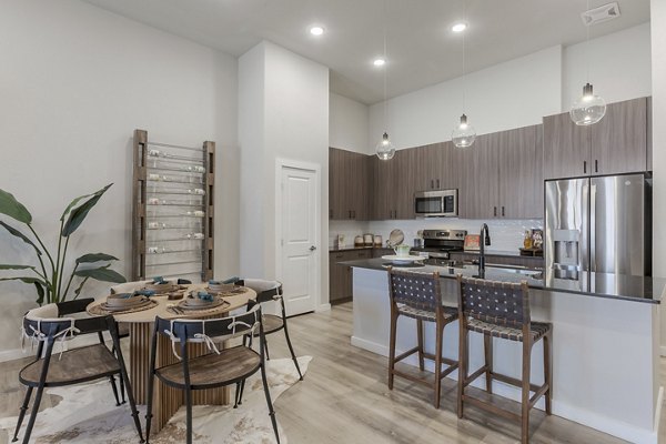 Living room featuring stylish decor and hardwood floors in Overture Andalucia Apartments