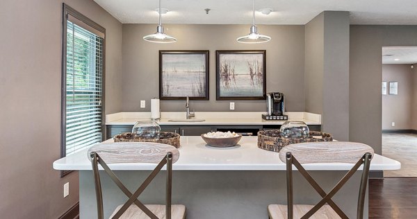 Modern clubhouse featuring elegant design and social seating at Somerset at the Crossings Apartments