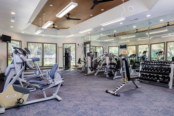 fitness center at The Trails at Canyon Creek Apartments 