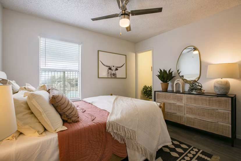 Comfortable bedroom with modern decor and large windows in Aydan Apartments