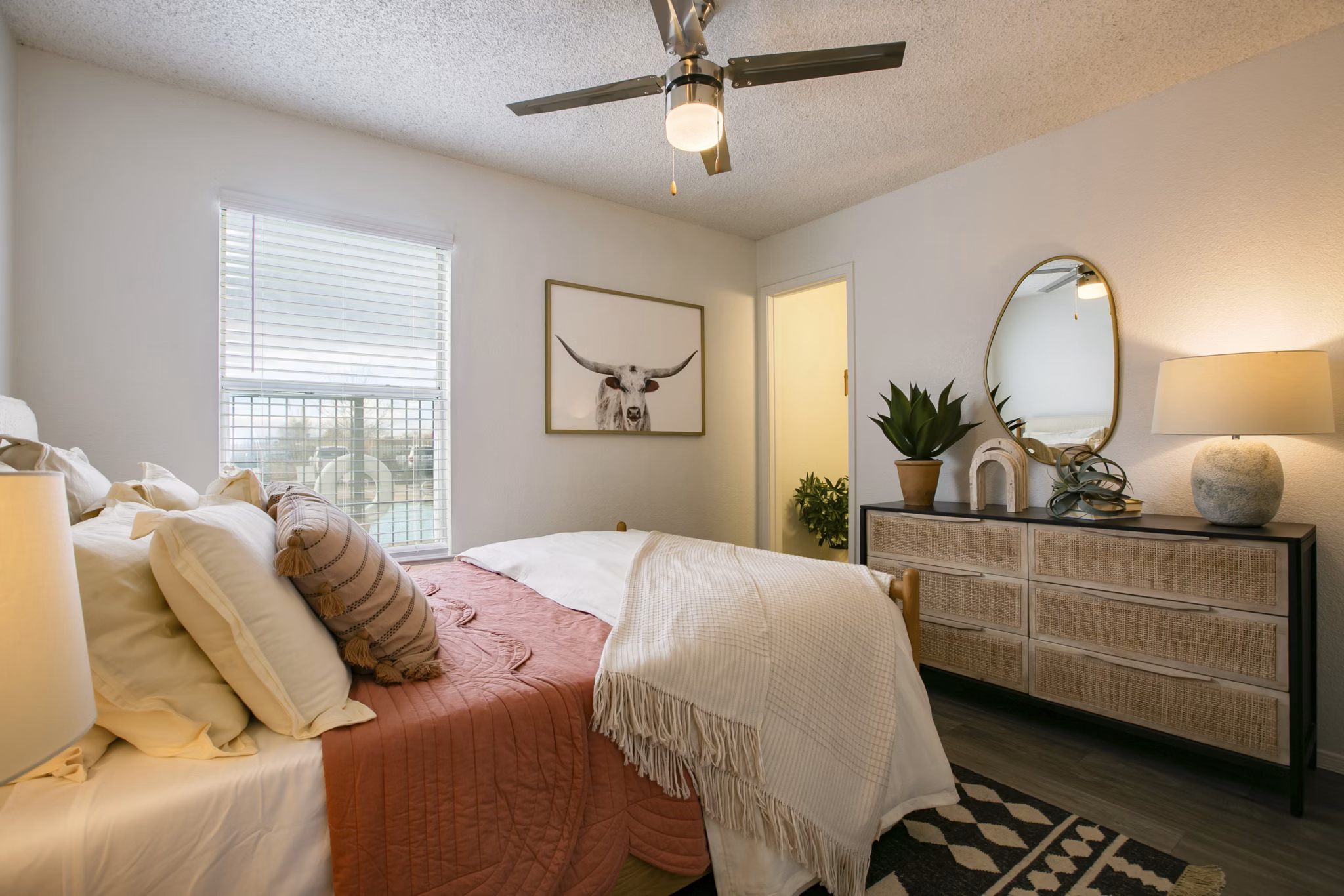 Comfortable bedroom with modern decor and large windows in Aydan Apartments