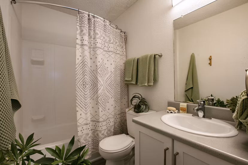 Aydan Apartments: Chic bathroom featuring modern fixtures and marble accents in luxury apartment by Greystar