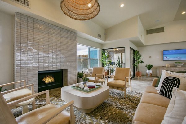 Clubhouse interior featuring modern furnishings and lighting at Aydan Apartments, a luxury property by Greystar