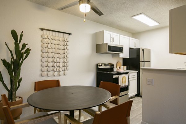Dining area with modern furnishings in Aydan Apartments