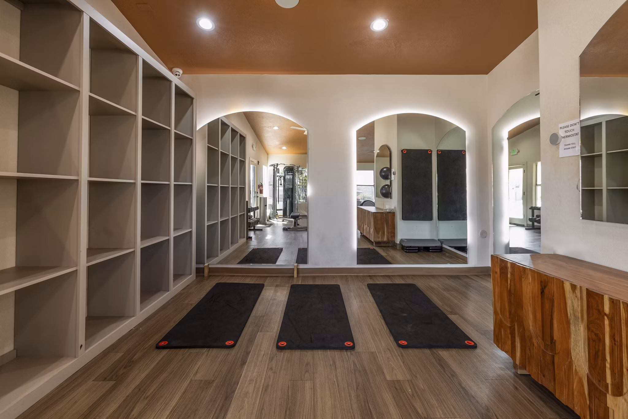 State-of-the-art fitness center at Aydan Apartments with modern equipment and spacious design for luxury living