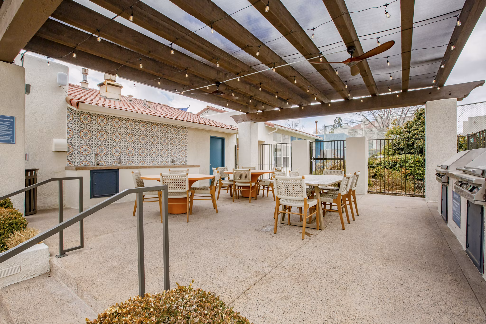 Outdoor grilling and dining area at Aydan Apartments