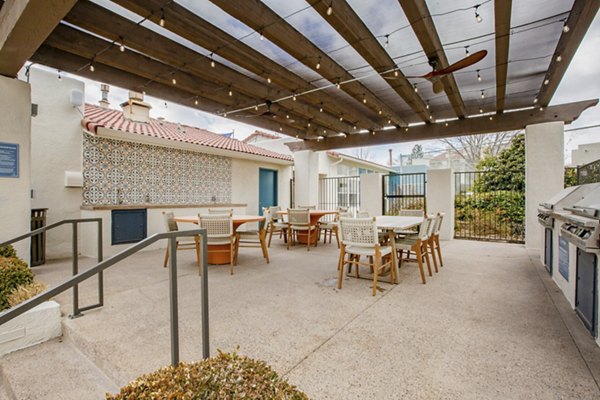 Outdoor grilling and dining area at Aydan Apartments