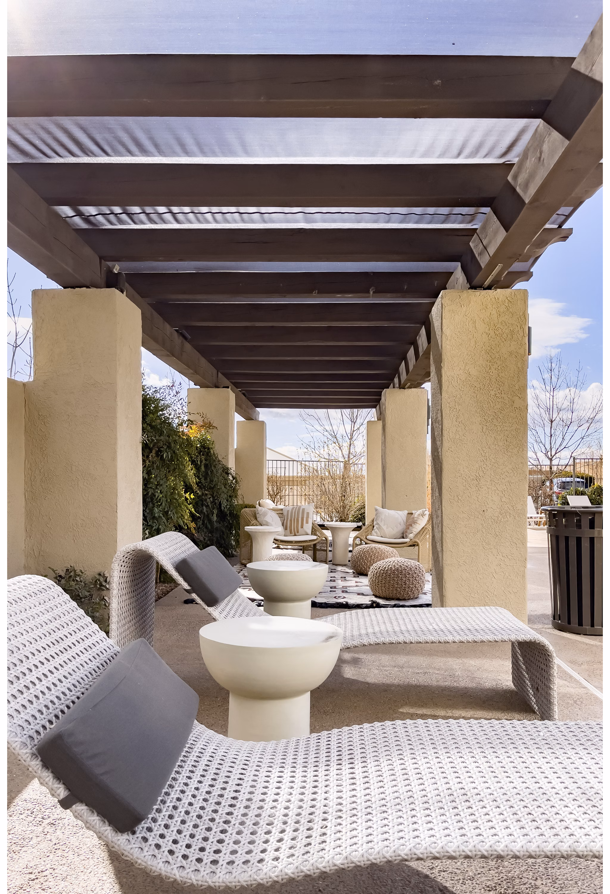 Patio with outdoor seating and lush greenery at Aydan Apartments, Greystar luxury community
