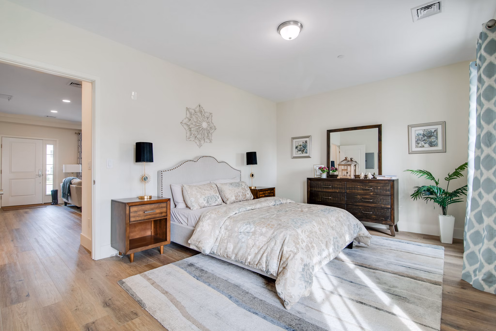 Cozy bedroom with modern decor at Vistas of Port Jefferson Apartments