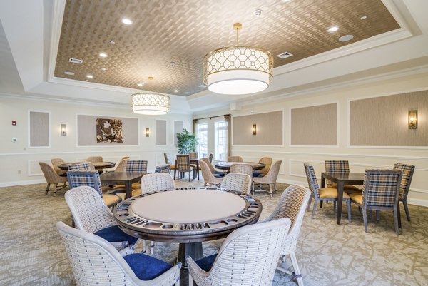 Clubhouse featuring modern design and comfortable seating at Vistas of Port Jefferson Apartments