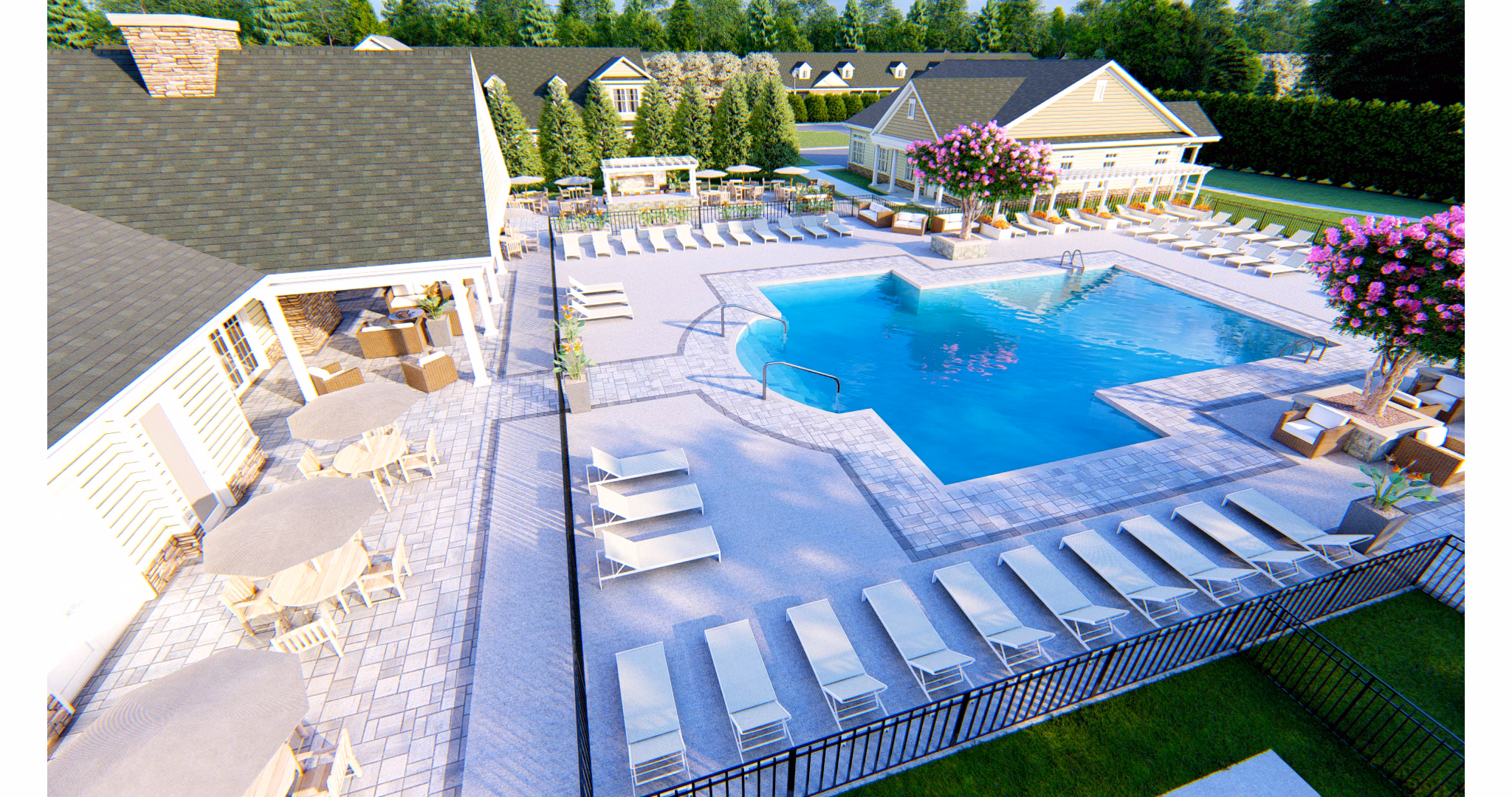 Resort-style pool with sun loungers at Vistas of Port Jefferson Apartments