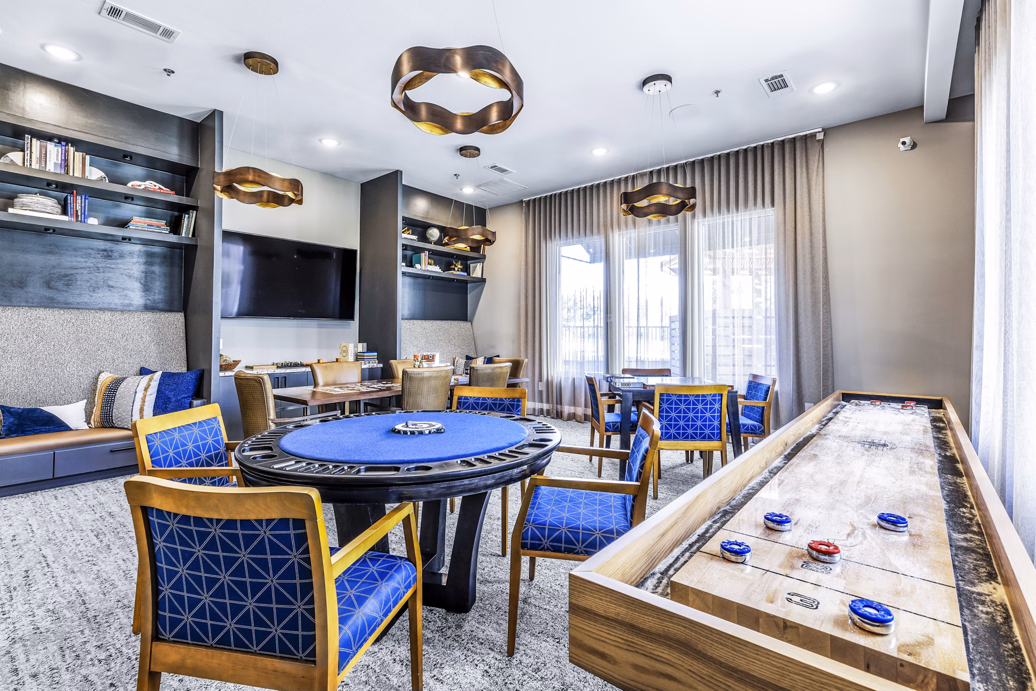 Luxury clubhouse game room with billiards in Album Mansfield Apartments, offering a vibrant social space for residents