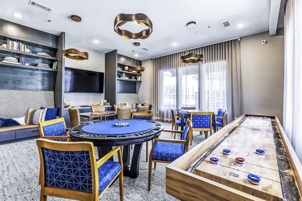 Luxury clubhouse game room with billiards in Album Mansfield Apartments, offering a vibrant social space for residents