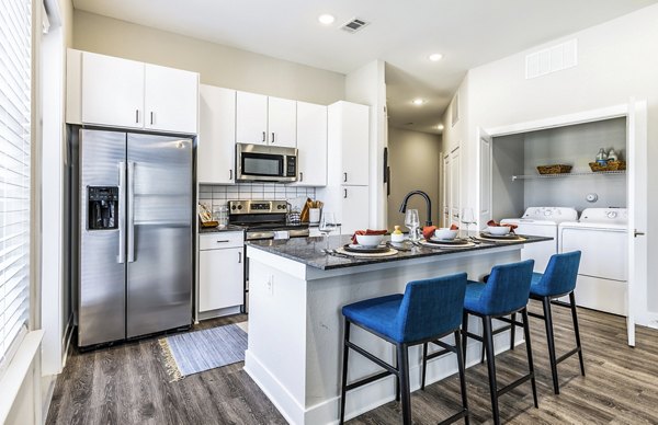 Modern kitchen with stainless steel appliances at Album Mansfield Apartments