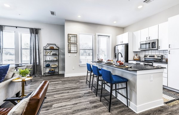 Modern kitchen with stainless steel appliances at Album Mansfield Apartments