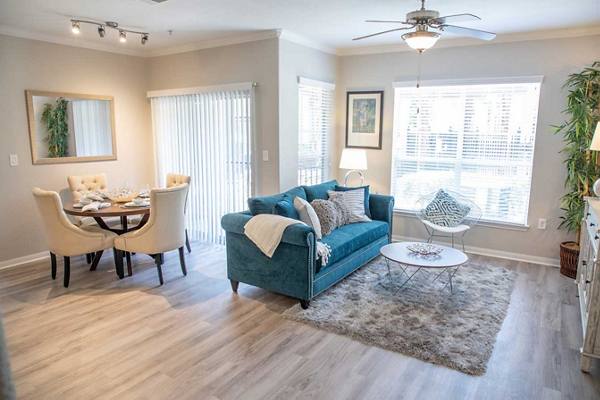 living room at Oasis at Piney Point Apartments