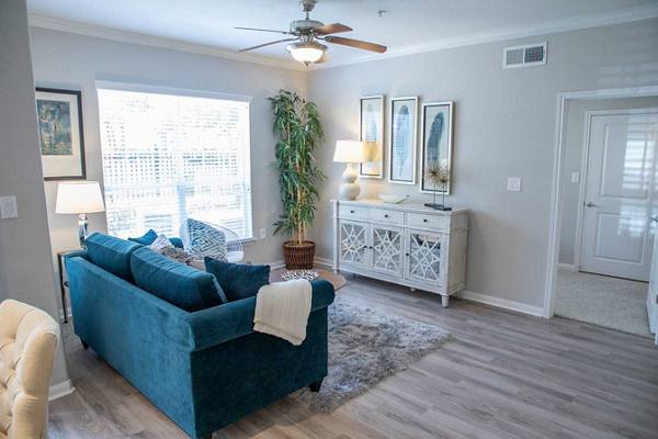 living room at Oasis at Piney Point Apartments
