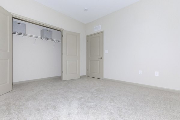 Cozy bedroom with contemporary design at The Lodges on English Station Rd Apartments Perfect for comfort and relaxation