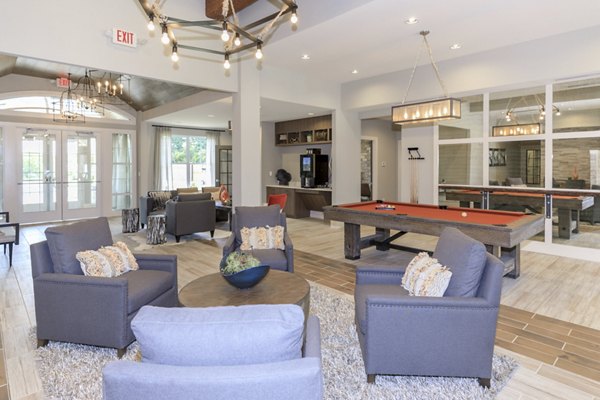 Stylish clubhouse with cozy seating area at The Lodges on English Station Rd Apartments for social gatherings