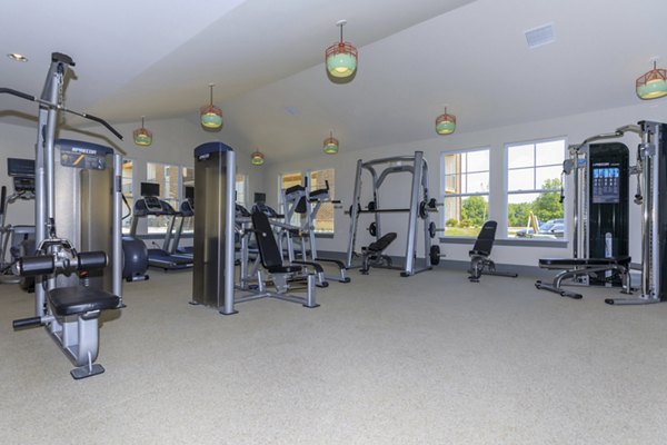State-of-the-art fitness center at The Lodges on English Station Rd Apartments, featuring modern equipment and spacious workout areas