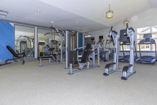 State-of-the-art fitness center with modern equipment at The Lodges on English Station Rd Apartments