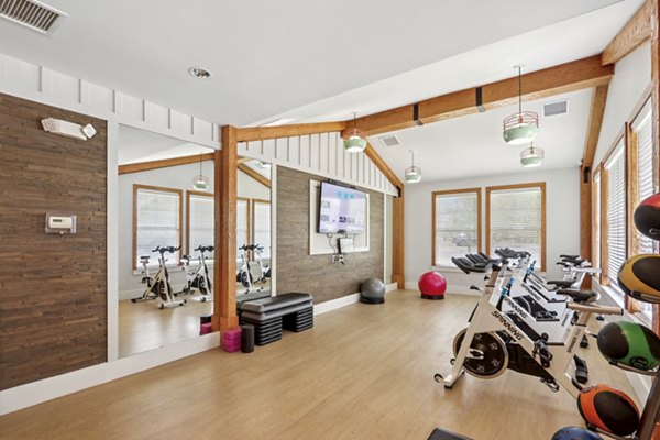 fitness center at The Lodges on English Station Rd. Apartments