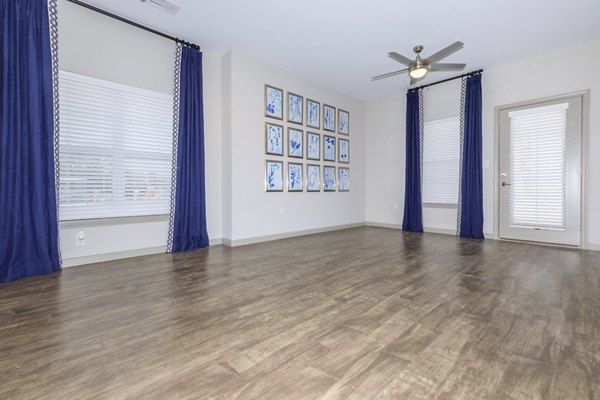 Modern living room with cozy furnishings at The Lodges on English Station Rd Apartments