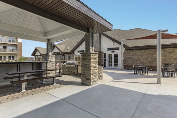 Grill area with modern amenities at The Lodges on English Station Rd Apartments, perfect for outdoor gatherings and relaxation