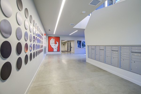Mail room with modern design at Connection on Broadway Apartments