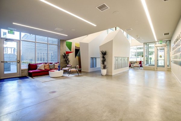 Modern clubhouse featuring sleek furnishings at Connection on Broadway Apartments