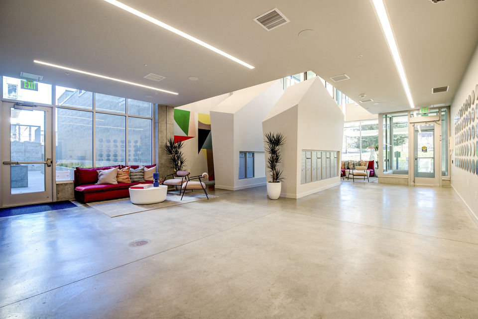 Modern clubhouse featuring sleek furnishings at Connection on Broadway Apartments
