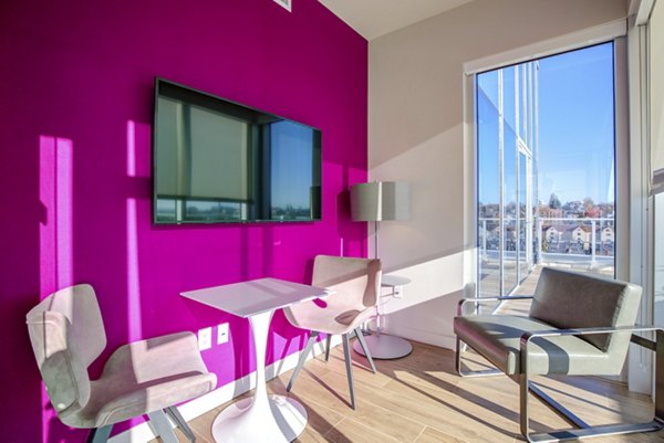 Clubhouse with modern design at Connection on Broadway Apartments, a luxury housing community
