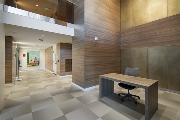 Clubhouse featuring modern seating and entertainment areas at Connection on Broadway Apartments