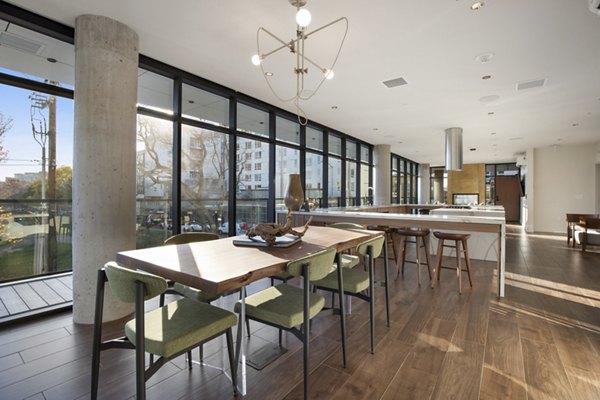 Clubhouse featuring modern furnishings and social spaces at Connection on Broadway Apartments, perfect for luxury living