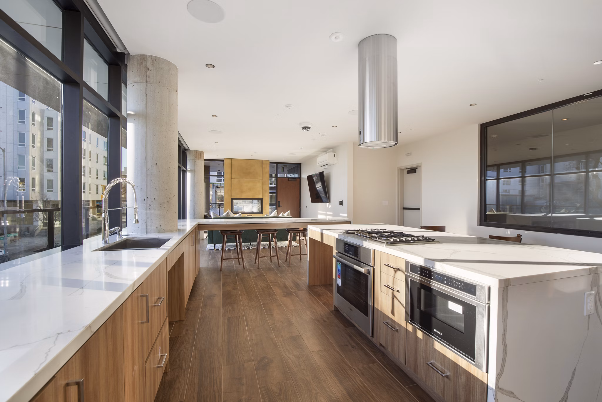 Elegant clubhouse with modern decor at Connection on Broadway Apartments, ideal for gatherings and events