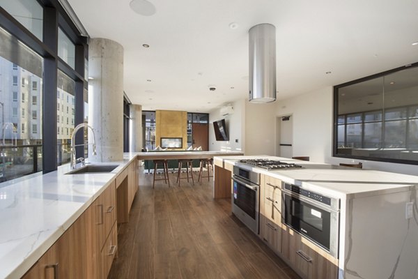 Elegant clubhouse with modern decor at Connection on Broadway Apartments, ideal for gatherings and events