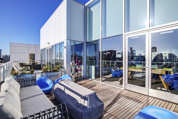 Outdoor fire pit area at Capitol Hill Station Apartments, ideal for social gatherings and relaxation