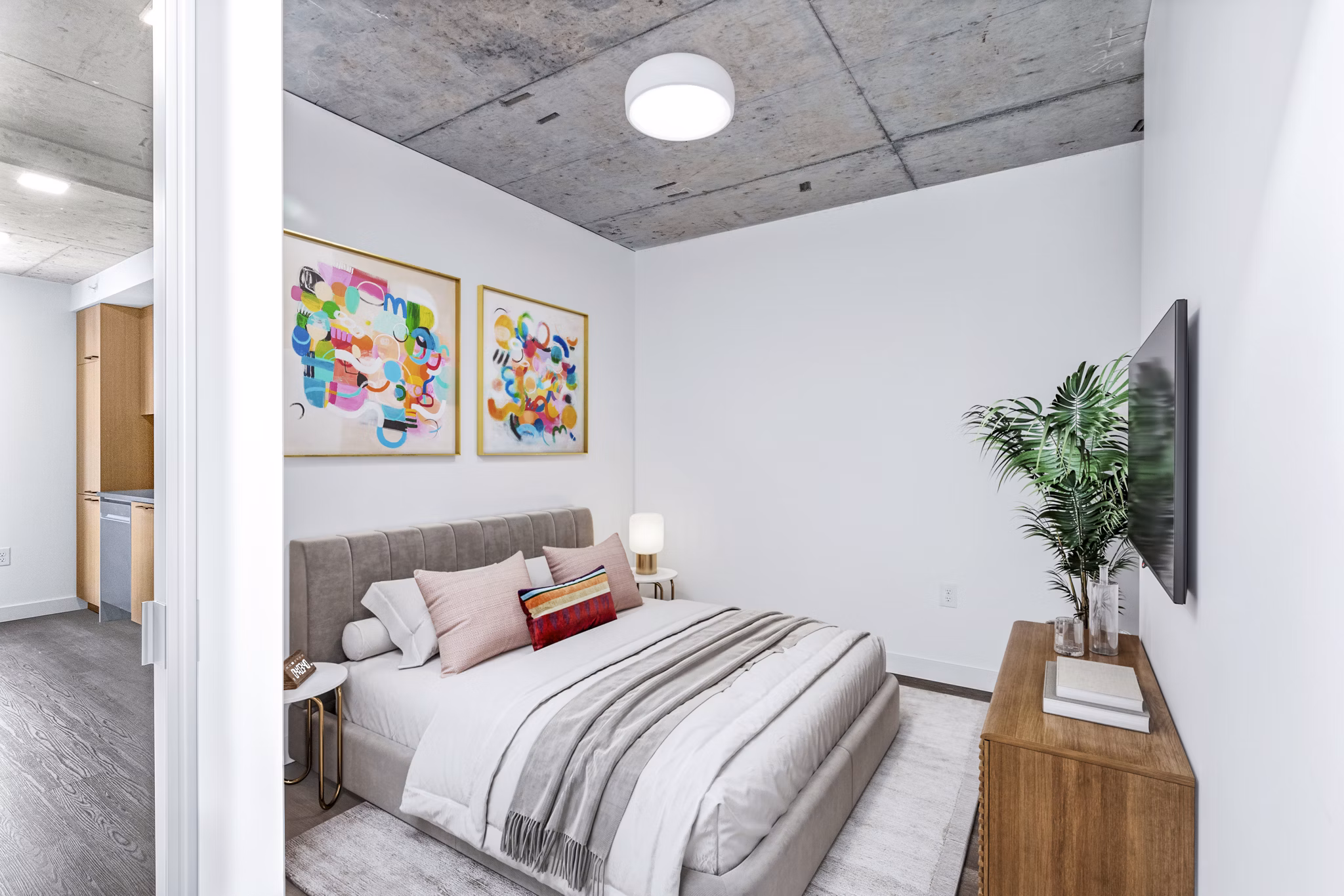 Cozy bedroom with modern decor at Connection on Broadway Apartments