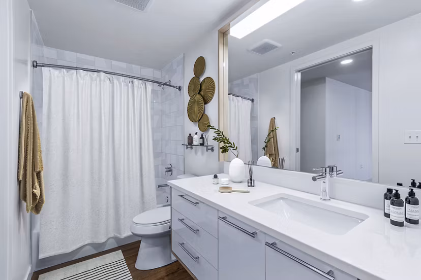 Bathroom featuring modern fixtures and spacious layout at Connection on Broadway Apartments