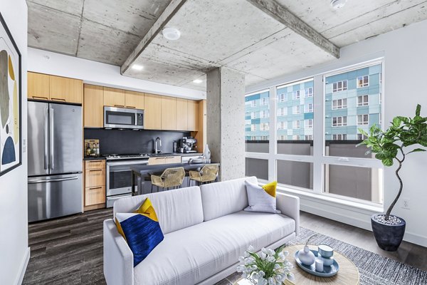 Sleek kitchen with stainless steel appliances at Connection on Broadway Apartments luxury units