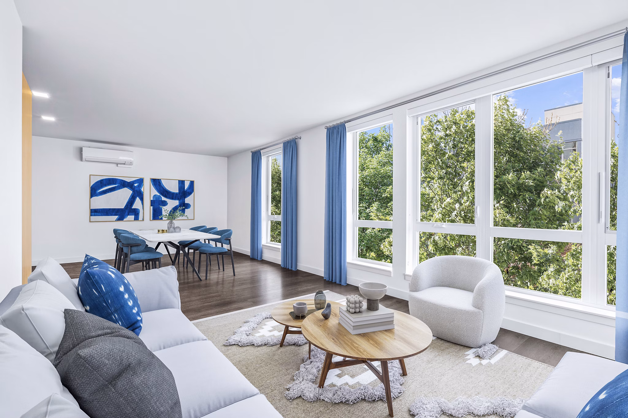 Living room featuring cozy seating and modern decor at Connection on Broadway Apartments