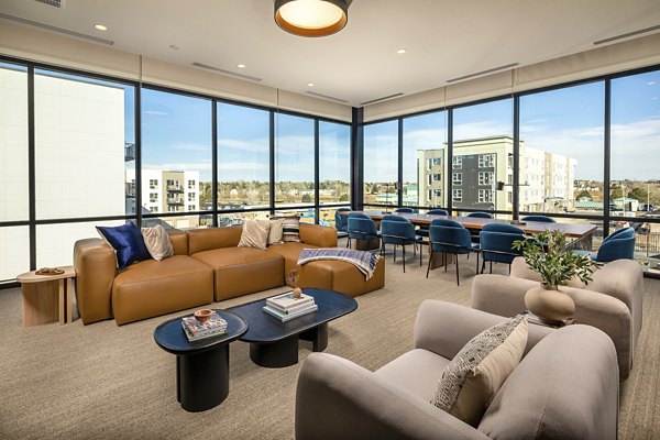 Luxurious clubhouse with modern design features at Revel Apartments, perfect for social gatherings and entertainment