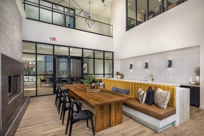 Clubhouse with modern design and seating areas at Revel Apartments