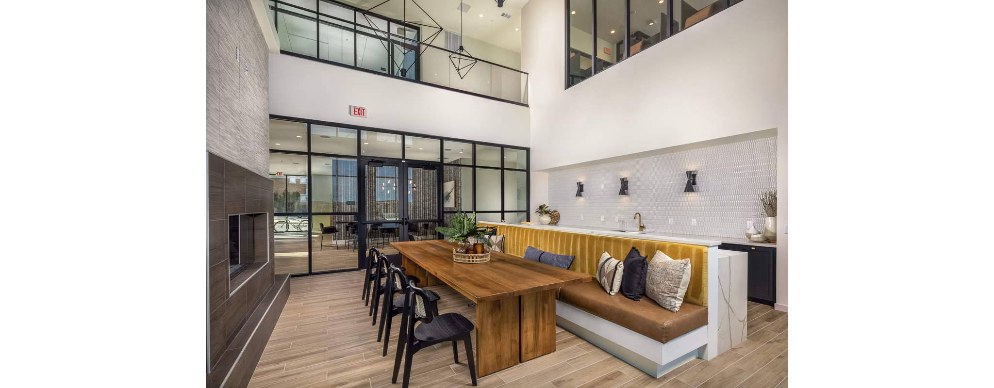 Clubhouse with modern design and seating areas at Revel Apartments